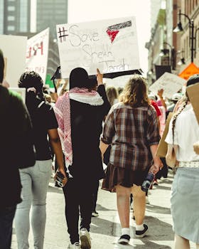 A woman holding a sign that says, women's rights are human rights